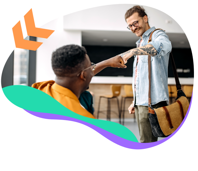 Two young men exchanging a fist bump